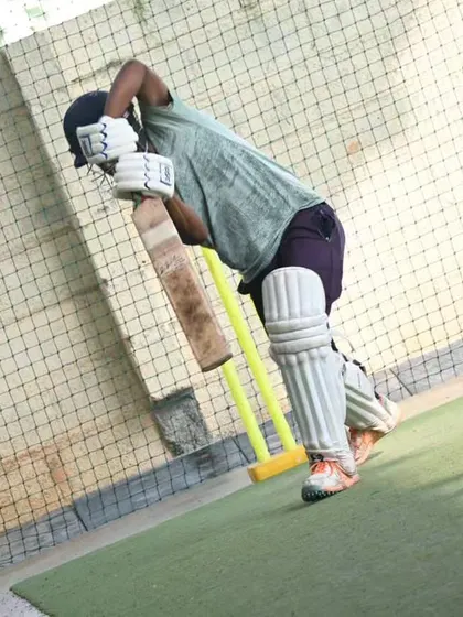 A senior player fully padded up, practicing his shots. We provide an environment where adults can train like professionals.