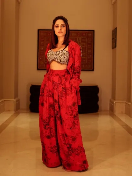 Here's a bold, printed red co-ord set I styled for Nushrratt Bharuccha. The embellished shoulder detail adds a touch of glam, making this a standout look for an evening event.