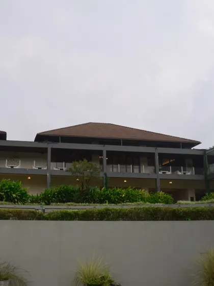 A view of the modern architecture of a premium resort nestled in nature. I ensure that all accommodations provide comfort and class for your team's offsite.