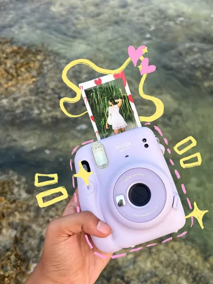 A polaroid at the beach, with doodles that make it look like it's popping out of the photo.
