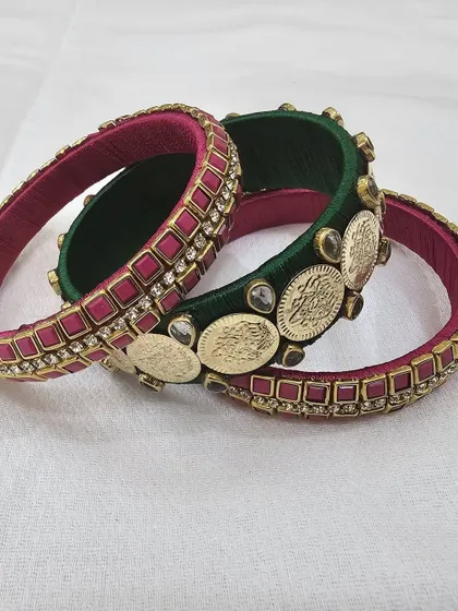The components of the green and pink bangle set displayed to show their individual beauty.