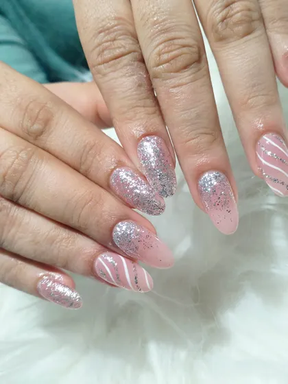 Another look at the elegant pink and silver glitter manicure, showcasing the clean lines and sparkling finish.