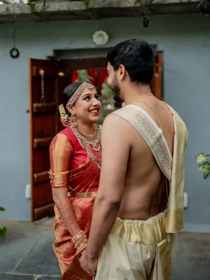 A moment of quiet connection amidst the grandeur of The Tamarind Tree. We love using the venue's stunning architecture to frame our couples, creating a story of romance and tradition.