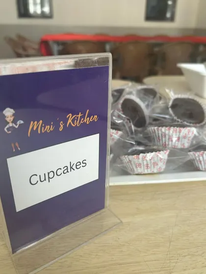 Individually wrapped chocolate cupcakes ready for a school event. These small touches make any lunch feel like a celebration and are a great way to boost team morale.