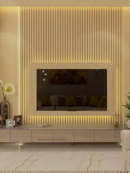A minimalist TV unit design with a fluted back panel and warm ambient backlighting. The clean lines of the floating console and the uncluttered setup contribute to a serene and contemporary living room aesthetic.