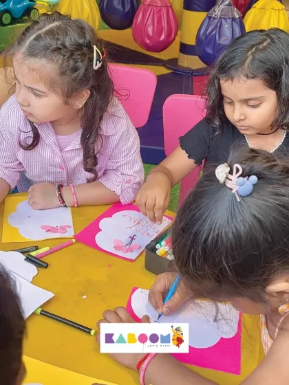 Children are deeply focused on creating beautiful cards during our Friendship Day celebration. It's a wonderful way to make something special for their best pals.