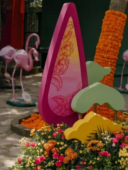 A quirky decor element featuring pink flamingos and colorful printed panels.