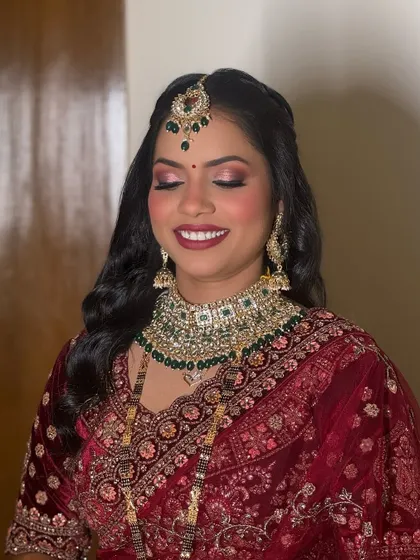 A close-up of the royal bridal makeup. The eyes are the focus, with a blend of shimmer and matte eyeshadows, paired with a deep lip color for a majestic finish.