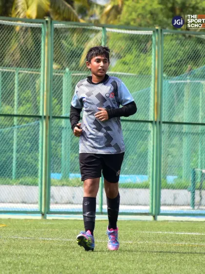 A U13 player in motion during a training drill, building the endurance and game awareness needed for competitive football.