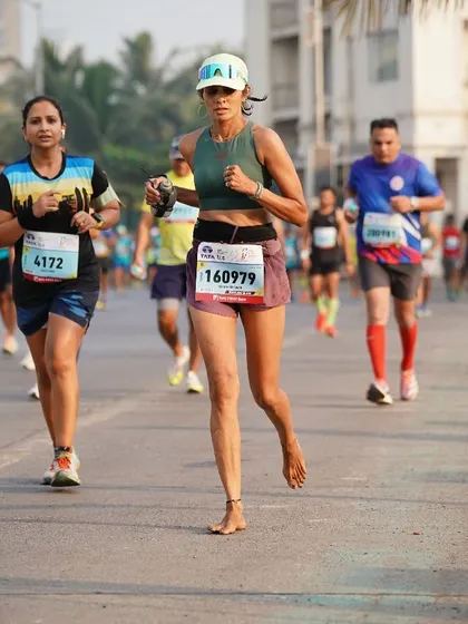 Barefoot running on the streets of Mumbai. This is my signature style, and I coach others on proper form, whether with or without shoes.