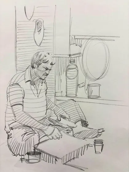 A sketch of a man working, capturing a candid moment of daily life.