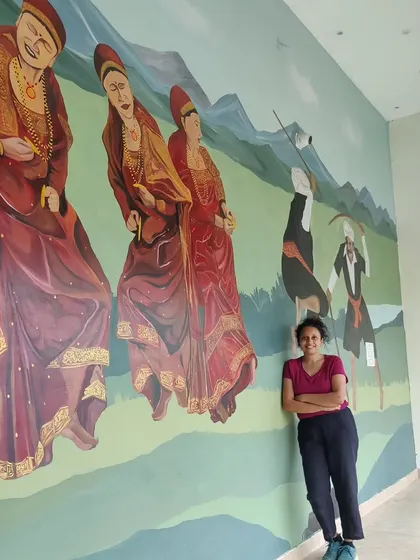 Standing proudly next to the completed section of the Coorg mural. This project was a deep dive into the local culture and traditions.