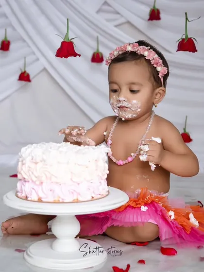 Getting into the fun, with frosting on her face and hands.