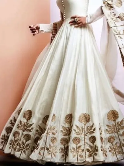 An inspiration photo for a beautiful white and gold Anarkali gown. I love working with clients to bring elegant designs like this to life with custom embroidery and tailoring.