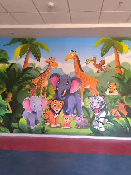 A similar jungle animal mural, featuring a slightly different cast of characters. These custom murals can be adapted to fit any wall size.