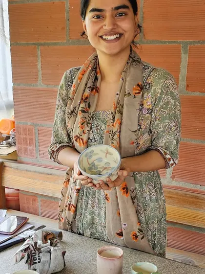 This is what it's all about for me. Seeing a student so happy and proud of the beautiful bowl she created and painted herself makes my heart full. It’s a joy to be a part of their creative journey.