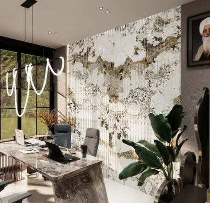 A close-up of the director's cabin in the Matta Properties office, showing the marble desk and a stunning feature wall.