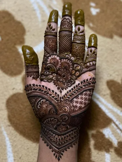 Being creative is a way of life for me. This design shows my love for detailed, flowing patterns that fill the hand beautifully.