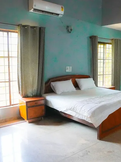 The bedrooms in our villa are designed for comfort and rest. After a full day of activities, your team can recharge in these clean, air-conditioned rooms with simple, modern furnishings.