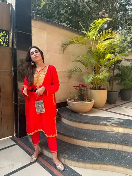 A favorite look from last year's festivities. This self-designed red Kashmiri suit is vibrant and perfect for a winter celebration.