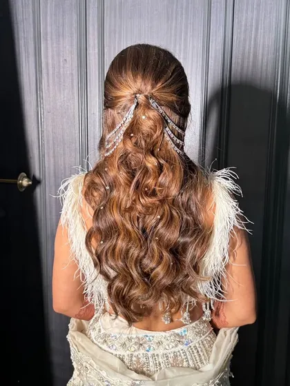 A detailed look at the intricate, jeweled hairstyle we created for the sister-in-law. It adds a touch of modern glamour to her traditional outfit.