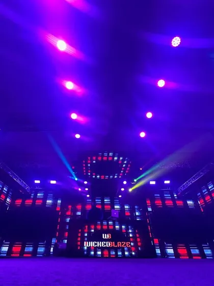 An empty hall before the storm. This shot shows the scale of the stage and visual setup I work with for major corporate gigs.