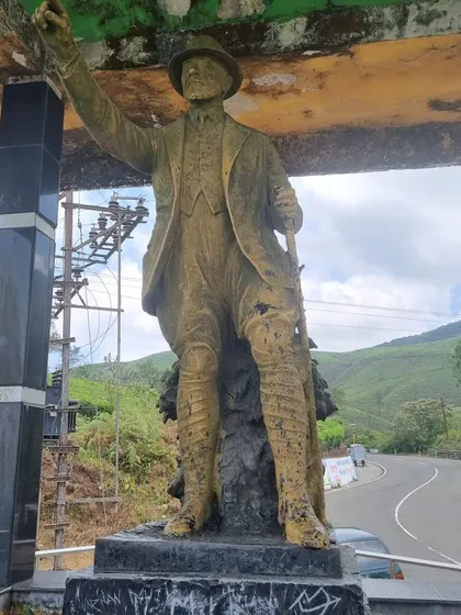 A statue commemorating the pioneers who built the roads through the hills of Valparai. Our trips here are a journey through history and stunning natural beauty.