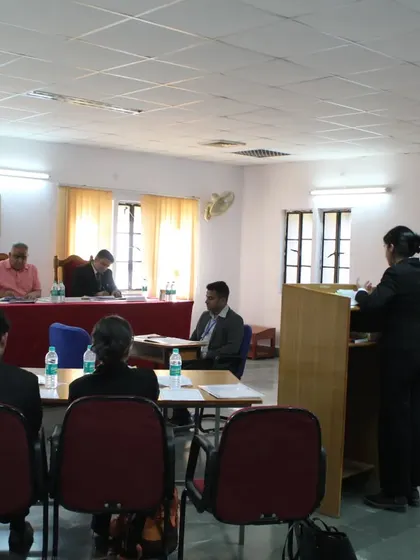 Observing a student advocate present her arguments during the moot court competition at NLU Jodhpur.