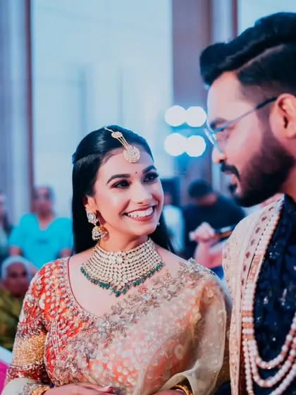 A beautiful, happy smile from the bride as she looks at her groom during their reception.