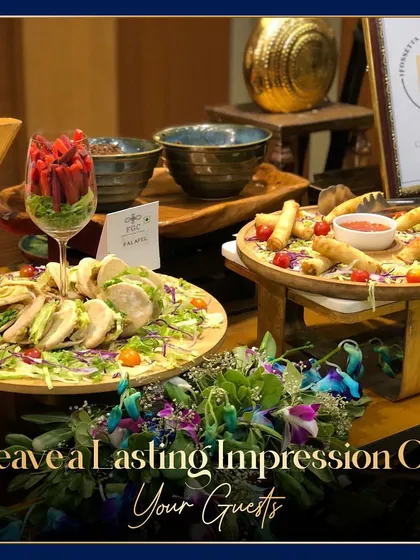 A vibrant display of our appetizers, including fresh salads and crispy spring rolls. The text overlay, "Leave a Lasting Impression On Your Guests," reinforces our commitment to creating memorable food experiences.