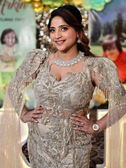 Dripping in glam and confidence. A client looking absolutely stunning in one of our heavily embellished gowns at a birthday party.