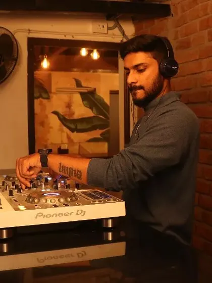 Here I am at my console, preparing the next track. Every event gets my full attention, with careful preparation to ensure the music flows perfectly throughout the night. This setup is perfect for private parties and cocktail hours.