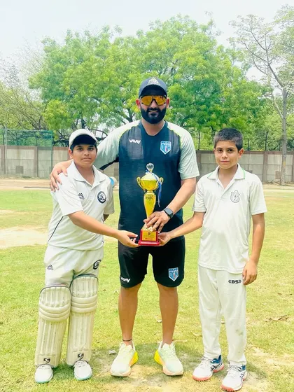 With the two top performers of the tournament, holding the trophy. Their dedication is inspiring.