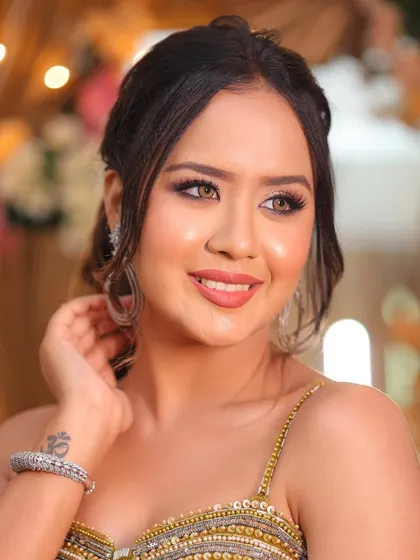 A happy and radiant client. Our goal is to create looks that not only photograph beautifully but also make the client feel confident and joyful.