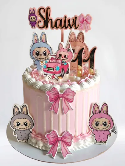 A cute and trendy Labubu-themed cake for an 11th birthday. This pink whipped cream cake features the popular art toy characters.