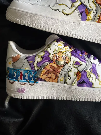 Detailed view of the other side of the Luffy Gear 5 sneaker, highlighting the dynamic artwork and purple accents.