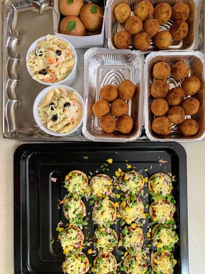Party snacks including Mini Pizzas, White Sauce Pasta, Mini Burgers, and Corn & Cheese Balls.