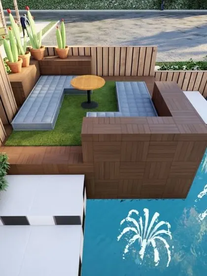 This design cleverly incorporates multi-level seating next to a small pool. The use of wood, turf, and checkered tiles creates distinct zones, while built-in planters with cacti add a touch of desert chic.