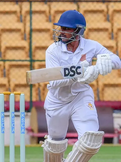 A batsman in full concentration during a KSCA league match. The journey to greatness requires focus, and we instill this discipline in every player.
