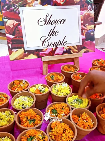 A thoughtful detail for the Haldi ceremony: small terracotta pots filled with flower petals for guests to shower the happy couple with blessings.