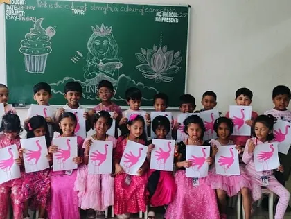 Students display their pink flamingo crafts, a fun art project that was part of our Pink Day activities.