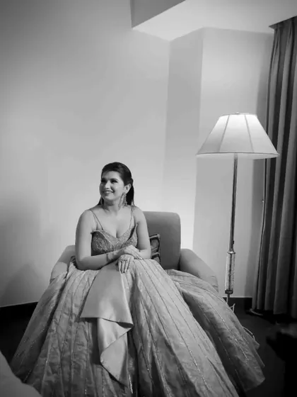 A stunning black and white portrait of the bride-to-be on her engagement day. Her ballgown looks magnificent in this full-length shot.