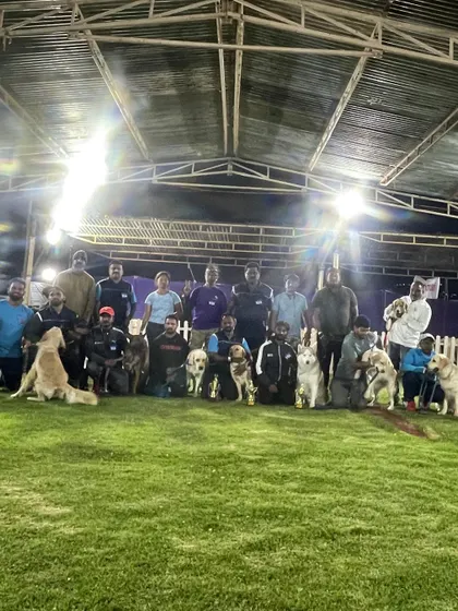 A group shot of the team under the lights at the Ooty venue.