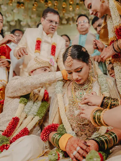 A candid moment from the wedding ceremony, capturing the emotions and the traditional rituals.