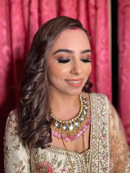 The eyes-closed shot showcases the seamless blending of the smokey eyeshadow.
