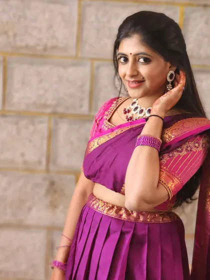 Another look at the beautiful purple half-saree. The details in the border and the blouse are just stunning.