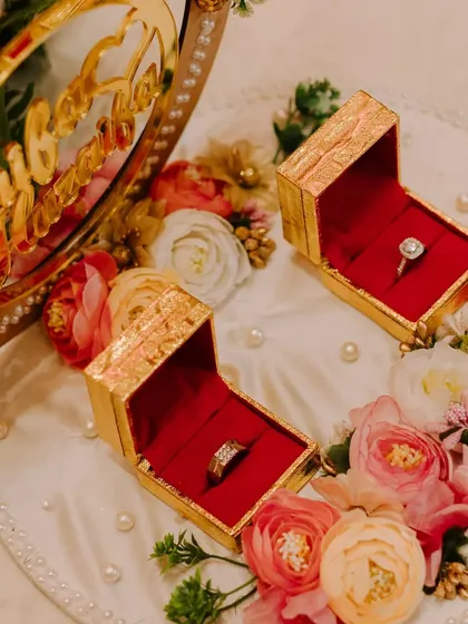 The engagement ring platter, beautifully decorated with flowers and pearls, showcasing how I attend to every detail of the ceremony.
