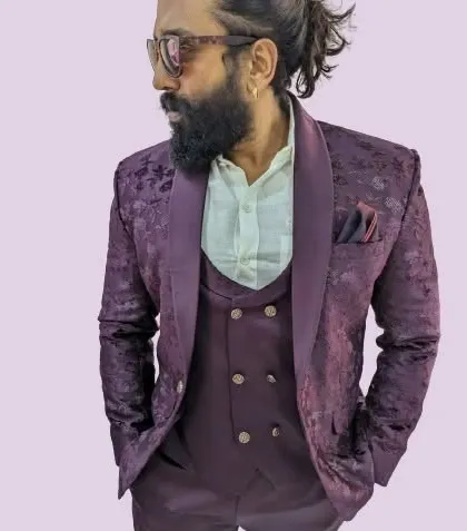 A closer look at the beautiful texture and shawl lapel of our new wine jacquard three-piece tuxedo.
