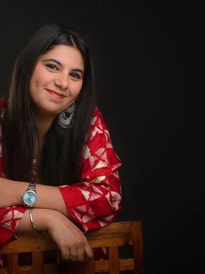 A relaxed, seated portrait that feels natural and confident. This type of shot is great for showing personality beyond a simple smiling headshot.