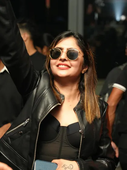 A cool and confident look from a stylish partygoer.